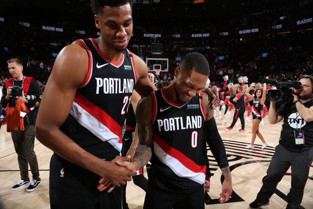 PORTLAND, OR - JANUARY 20: Hassan Whiteside #21 of the Portland Trail Blazers and Damian Lillard #0 of the Portland Trail Blazers after the game on January 20, 2020 at the Moda Center Arena in Portland, Oregon. NOTE TO USER: User expressly acknowledges and agrees that, by downloading and or using this photograph, user is consenting to the terms and conditions of the Getty Images License Agreement. Mandatory Copyright Notice: Copyright 2020 NBAE (Photo by Sam Forencich/NBAE via Getty Images)