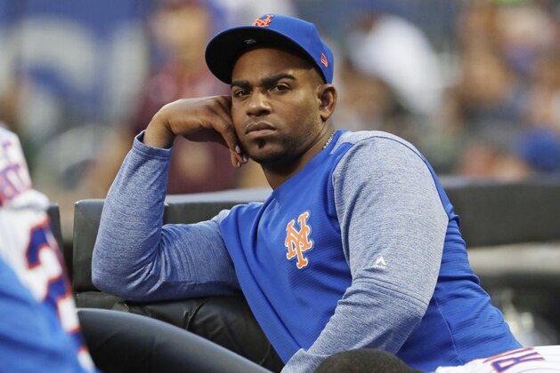 FILE - In this July 24, 2018, file photo, New York Mets' Yoenis Cespedes looks on as his team play the San Diego Padres during the first inning of a baseball game in New York. Cespedes' salary for 2019 was cut in half and his pay for 2020 reduced as part of a settlement of a grievance between the injured outfielder and the Mets. He agreed to a $110 million, four-year contract in December 2016 but has not played since July 20, 2018. The outfielder had surgery to remove bone calcification from his right heel on Aug. 2, 2018, and his left that Oct. 26. (AP Photo/Frank Franklin II, File) FILE - In this July 24, 2018, file photo, New York Mets' Yoenis Cespedes looks on as his team play the San Diego Padres during the first inning of a baseball game in New York. Cespedes' salary for 2019 was cut in half and his pay for 2020 reduced as part of a settlement of a grievance between the injured outfielder and the Mets. He agreed to a $110 million, four-year contract in December 2016 but has not played since July 20, 2018. The outfielder had surgery to remove bone calcification from his right heel on Aug. 2, 2018, and his left that Oct. 26. (AP Photo/Frank Franklin II, File)