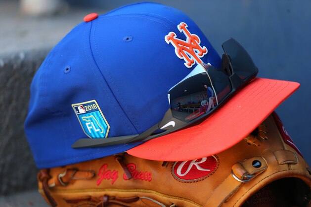 WEST PALM BEACH, FL - MARCH 08: The The New Era cap, Rawlings glove and Nike sunglasses of Jay Bruce #19 of the New York Mets in the dugout during a spring training game against the Washington Nationals  at FITTEAM Ball Park of the Palm Beaches on March 8, 2018 in West Palm Beach, Florida. (Photo by Rich Schultz/Getty Images)