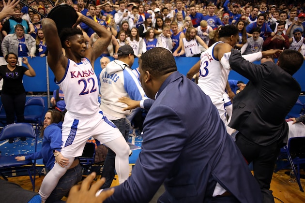 LAWRENCE, KANSAS - JANUARY 21:  Silvio De Sousa #22 of the Kansas Jayhawks picks up a chair during a brawl as the game against the Kansas State Wildcats ends at Allen Fieldhouse on January 21, 2020 in Lawrence, Kansas. (Photo by Jamie Squire/Getty Images)