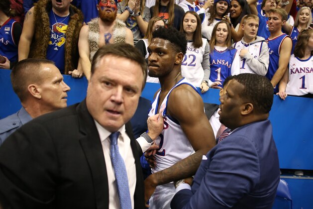 LAWRENCE, KANSAS - JANUARY 21:  Head coach Bill Self of the Kansas Jayhawks holds back Silvio De Sousa #22 of the Kansas Jayhawks during a brawl as the game against the Kansas State Wildcats ends at Allen Fieldhouse on January 21, 2020 in Lawrence, Kansas. (Photo by Jamie Squire/Getty Images)