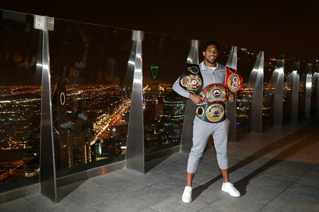 RIYADH, SAUDI ARABIA - DECEMBER 08: Two time Heavyweight Champion of the World, Anthony Joshua poses for pictures overlooking Riyadh after the IBF, WBA, WBO & IBO World Heavyweight Title Fight between Andy Ruiz Jr and Anthony Joshua at the the Al Faisaliah Hotel on December 08, 2019 in Riyadh, Saudi Arabia. (Photo by Richard Heathcote/Getty Images)