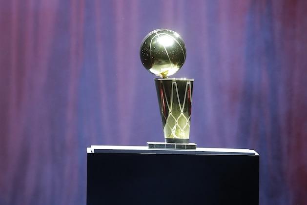 The Larry O'Brien NBA Championship Trophy rises from the from a box on stage, Monday, June 24, 2013 during a celebration for season ticket holders at the American Airlines Arena in Miami. The Heat defeated the San Antonio Spurs 95-88 in Game 7 to win their second straight NBA championship. (AP Photo/Wilfredo Lee)