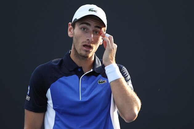 MELBOURNE, AUSTRALIA - JANUARY 21:  Elliot Benchetrit of France reacts during his Men's Singles first round match against Yuichi Sugita of Japan on day two of the 2020 Australian Open at Melbourne Park on January 21, 2020 in Melbourne, Australia. (Photo by Mark Kolbe/Getty Images)