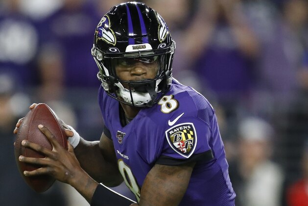 Baltimore Ravens quarterback Lamar Jackson (8) runs out of the pocket against the Tennessee Titans during the first half an NFL divisional playoff football game, Saturday, Jan. 11, 2020, in Baltimore. (AP Photo/Julio Cortez)