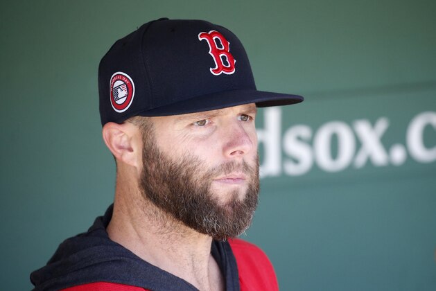 Boston Red Sox player Dustin Pedroia looks out from the dugout before the start of a baseball game against the Cleveland Indians, Monday, May 27, 2019, in Boston. (AP Photo/Mary Schwalm)