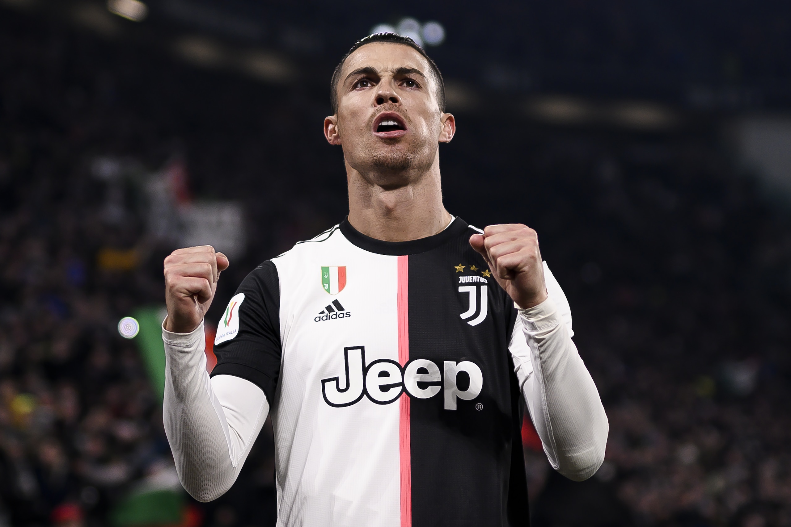 Juventus' Portuguese forward Cristiano Ronaldo celebrates after opening the scoring during the Italian Cup (Coppa Italia) round of 8 football match Juventus vs AS Roma on January 22, 2020 at the Juventus stadium in Turin. (Photo by Marco BERTORELLO / AFP) (Photo by MARCO BERTORELLO/AFP via Getty Images)