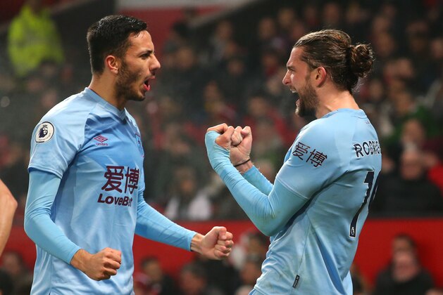 MANCHESTER, ENGLAND - JANUARY 22: Jay Rodriguez of Burnley celebrates with Dwight McNeil after scoring his team's second goal  during the Premier League match between Manchester United and Burnley FC at Old Trafford on January 22, 2020 in Manchester, United Kingdom. (Photo by Alex Livesey/Getty Images)