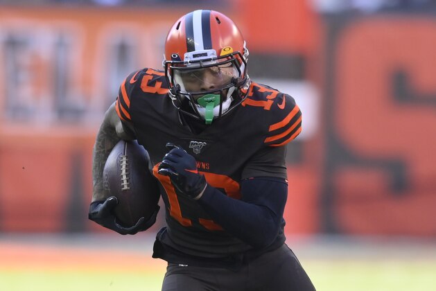 Cleveland Browns wide receiver Odell Beckham Jr. runs with the ball during an NFL football game against the Baltimore Ravens, Sunday, Dec. 22, 2019, in Cleveland. The Ravens won 31-15. (AP Photo/David Richard)
