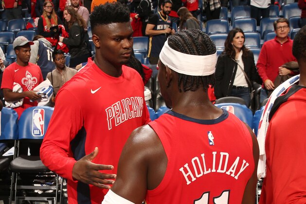NEW ORLEANS, LA - JANUARY 22: Zion Williamson #1 of the New Orleans Pelicans high-fives Jrue Holiday #11 of the New Orleans Pelicans after the game against the San Antonio Spurs on January 22, 2020 at the Smoothie King Center in New Orleans, Louisiana. NOTE TO USER: User expressly acknowledges and agrees that, by downloading and or using this Photograph, user is consenting to the terms and conditions of the Getty Images License Agreement. Mandatory Copyright Notice: Copyright 2020 NBAE (Photo by Layne Murdoch Jr./NBAE via Getty Images)