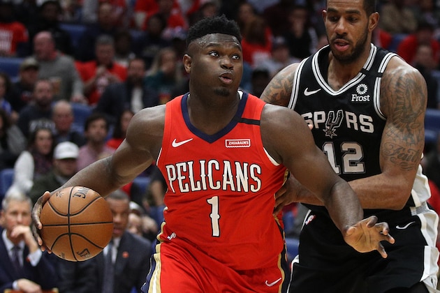 NEW ORLEANS, LOUISIANA - JANUARY 22: Zion Williamson #1 of the New Orleans Pelicans drives the ball around LaMarcus Aldridge #12 of the San Antonio Spurs at Smoothie King Center on January 22, 2020 in New Orleans, Louisiana. NOTE TO USER: User expressly acknowledges and agrees that, by downloading and/or using this photograph, user is consenting to the terms and conditions of the Getty Images License Agreement.   (Photo by Chris Graythen/Getty Images)