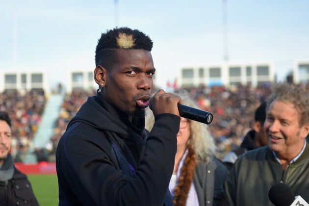 Manchester United and France midfielder Paul Pogba speaks prior to a gala football match between All Star France and Guinea at the Vallee du Cher Stadium in Tours, central France, on December 29, 2019, as part of the