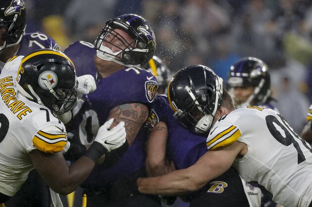 BALTIMORE, MD - DECEMBER 29: The helmet of T.J. Watt #90 of the Pittsburgh Steelers pops up as he tackles Justin Tucker #9 of the Baltimore Ravens during the first half at M&T Bank Stadium on December 29, 2019 in Baltimore, Maryland. (Photo by Scott Taetsch/Getty Images)