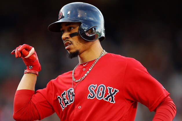 BOSTON, MASSACHUSETTS - SEPTEMBER 29: Mookie Betts #50 of the Boston Red Sox celebrates after hitting a single during the third inning against the Baltimore Orioles at Fenway Park on September 29, 2019 in Boston, Massachusetts. (Photo by Maddie Meyer/Getty Images)