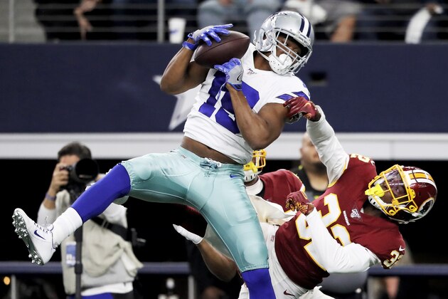 ARLINGTON, TEXAS - DECEMBER 29: Amari Cooper #19 of the Dallas Cowboys makes a catch while being guarded by Jimmy Moreland #32 of the Washington Redskins in the second quarter in the game at AT&T Stadium on December 29, 2019 in Arlington, Texas. (Photo by Ronald Martinez/Getty Images)