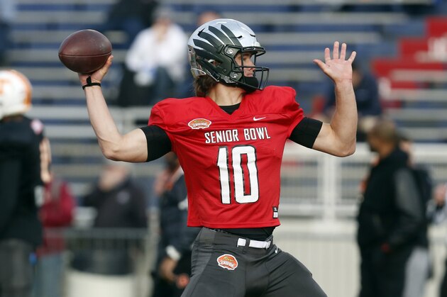 Oregon's Justin Herbert of the South squad runs drills during practice for the Senior Bowl college football game, Wednesday, Jan. 22, 2020, in Mobile, Ala. (AP Photo/Butch Dill)