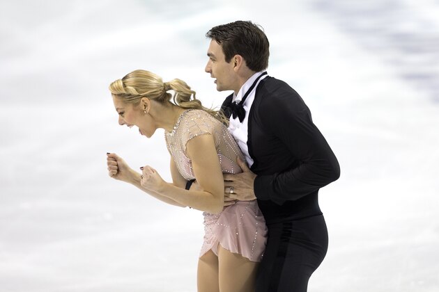 Alexa Knierim and Christopher Knierim react at the completion of their program in the senior pairs at the U.S. Figure Skating Championships Thursday, Jan. 23, 2020 in Greensboro, N.C. They are in currently in first place after the program. (AP Photo/Lynn Hey)