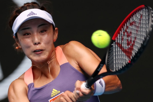 China's Wang Qiang serves against Serena Williams of the US during their women's singles match on day five of the Australian Open tennis tournament in Melbourne on January 24, 2020. (Photo by DAVID GRAY / AFP) / IMAGE RESTRICTED TO EDITORIAL USE - STRICTLY NO COMMERCIAL USE (Photo by DAVID GRAY/AFP via Getty Images) China's Wang Qiang serves against Serena Williams of the US during their women's singles match on day five of the Australian Open tennis tournament in Melbourne on January 24, 2020. (Photo by DAVID GRAY / AFP) / IMAGE RESTRICTED TO EDITORIAL USE - STRICTLY NO COMMERCIAL USE (Photo by DAVID GRAY/AFP via Getty Images)