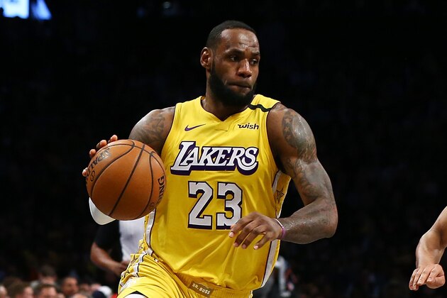 NEW YORK, NEW YORK - JANUARY 23:  LeBron James #23 of the Los Angeles Lakers drives to the basket against Spencer Dinwiddie #8 of the Brooklyn Nets at Barclays Center on January 23, 2020 in New York City. NOTE TO USER: User expressly acknowledges and agrees that, by downloading and or using this photograph, User is consenting to the terms and conditions of the Getty Images License Agreement.  (Photo by Mike Stobe/Getty Images)