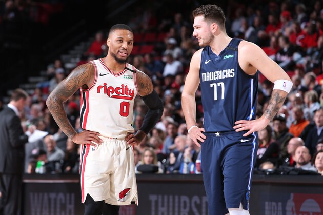 PORTLAND, OR - JANUARY 23: Damian Lillard #0 of the Portland Trail Blazers talks with Luka Doncic #77 of the Dallas Mavericks during the game on January 23, 2020 at the Moda Center Arena in Portland, Oregon. NOTE TO USER: User expressly acknowledges and agrees that, by downloading and or using this photograph, user is consenting to the terms and conditions of the Getty Images License Agreement. Mandatory Copyright Notice: Copyright 2020 NBAE (Photo by Sam Forencich/NBAE via Getty Images)