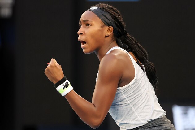 Coco Gauff of the US reacts after a point against Japan's Naomi Osaka during their women's singles match on day five of the Australian Open tennis tournament in Melbourne on January 24, 2020. (Photo by DAVID GRAY / AFP) / IMAGE RESTRICTED TO EDITORIAL USE - STRICTLY NO COMMERCIAL USE (Photo by DAVID GRAY/AFP via Getty Images)