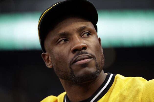 Pittsburgh Pirates' Starling Marte stands in the dugout during a baseball game against the Cincinnati Reds in Pittsburgh, Sunday, Sept. 29, 2019. Marte did not play in the game. The Reds won 3-1. (AP Photo/Gene J. Puskar)