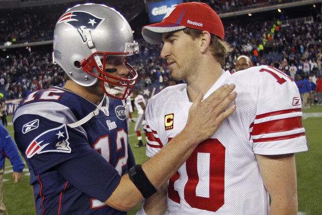 ADVANCE FOR WEEKEND EDITIONS, JAN. 28-29 -FILE - In this Nov. 6, 2011, file photo, New York Giants' Eli Manning, right, is congratulated by New England Patriots' Tom Brady after the Giants' 24-20 win in an NFL football game in Foxborough, Mass. The Patriots face the Giants in Super Bowl XLVI on Sunday, Feb. 5, 2012, in Indianapolis. (AP Photo/Charles Krupa, File)