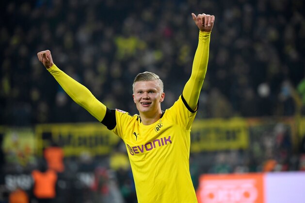 Dortmund's Norwegian forward Erling Braut Haaland celebrates scoring during the German first division Bundesliga football match Borussia Dortmund v FC Cologne in Dortmund, on January 24, 2020. (Photo by Ina FASSBENDER / AFP) / DFL REGULATIONS PROHIBIT ANY USE OF PHOTOGRAPHS AS IMAGE SEQUENCES AND/OR QUASI-VIDEO (Photo by INA FASSBENDER/AFP via Getty Images)