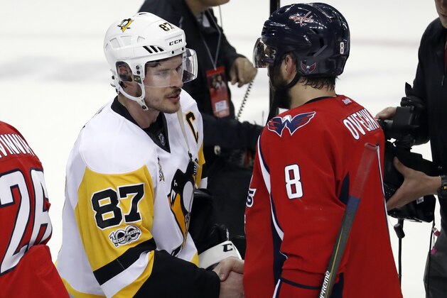 Washington Capitals left wing Alex Ovechkin (8), from Russia, talks with Pittsburgh Penguins center Sidney Crosby (87) after Game 7 in an NHL hockey Stanley Cup Eastern Conference semifinal, Wednesday, May 10, 2017, in Washington. The Penguins won 2-0. (AP Photo/Alex Brandon)
