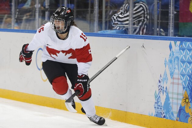 Melodie Daoust of Canada celebrates her goal against Switzerland during the first period of the 2014 Winter Olympics women's semifinal ice hockey game at Shayba Arena, Monday, Feb. 17, 2014, in Sochi, Russia. (AP Photo/Petr David Josek)