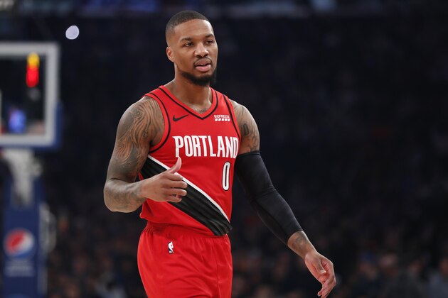 Portland Trail Blazers guard Damian Lillard (0) during a break in action in the first half of an NBA basketball game in New York, Wednesday, Jan. 1, 2020. (AP Photo/Kathy Willens)