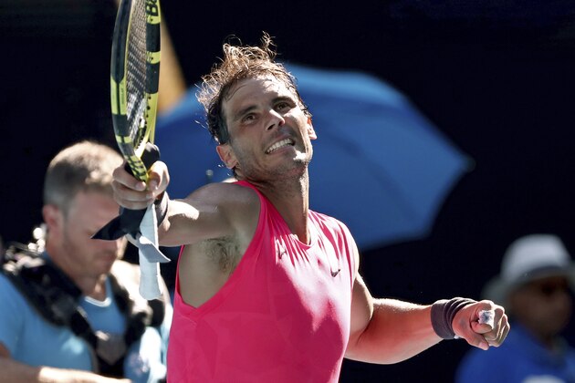 Spain's Rafael Nadal celebrates after defeating compatriot Pablo Carreno Busta during their third round singles match at the Australian Open tennis championship in Melbourne, Australia, Saturday, Jan. 25, 2020. (AP Photo/Dita Alangkara)