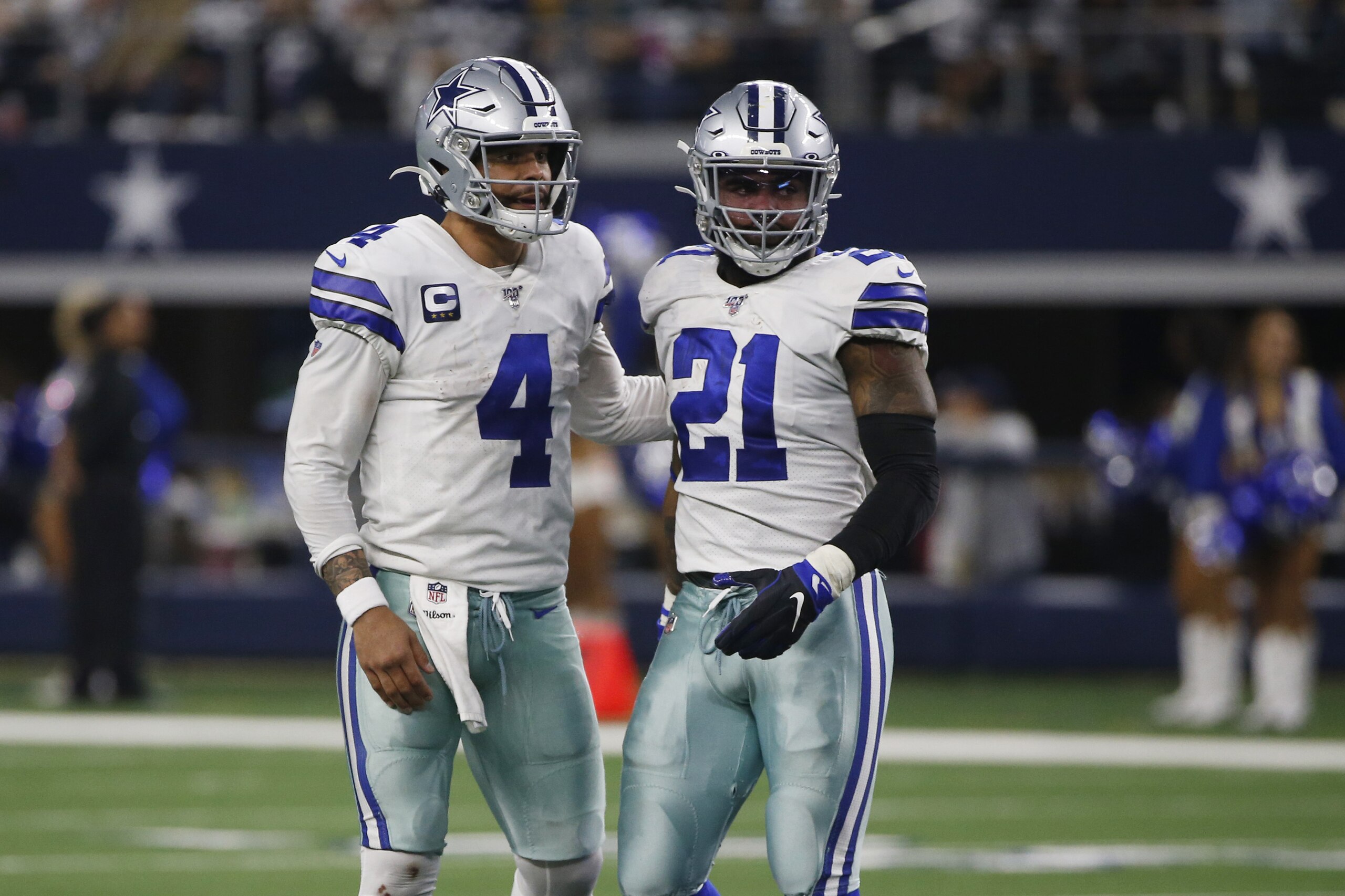 Dallas Cowboys quarterback Dak Prescott (4) and running back Ezekiel Elliott (21) during the second half of an NFL football game against the Washington Redskins in Arlington, Texas, Sunday, Dec. 15, 2019. (AP Photo/Ron Jenkins)