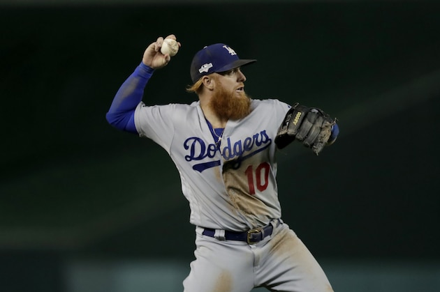 Los Angeles Dodgers third baseman Justin Turner throws to first base during the eighth inning of Game 4 of a baseball National League Division Series against the Washington Nationals Monday, Oct. 7, 2019, in Washington. (AP Photo/Julio Cortez)