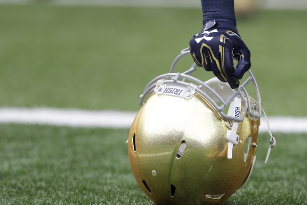 A Notre Dame player holds his helmet after running onto to field before an NCAA college football game Saturday, Oct. 29, 2016, in South Bend, Ind.   (AP Photo/Darron Cummings)