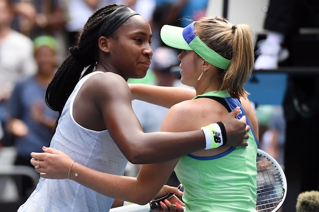 Sofia Kenin of the US gives a hug to Coco Gauff (L) of the US after their women's singles match on day seven of the Australian Open tennis tournament in Melbourne on January 26, 2020. (Photo by John DONEGAN / AFP) / IMAGE RESTRICTED TO EDITORIAL USE - STRICTLY NO COMMERCIAL USE (Photo by JOHN DONEGAN/AFP via Getty Images)