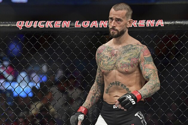 FILE - In this Saturday, Sept. 10, 2016 file photo, CM Punk stands in his corner before a welterweight bout at UFC 203 in Cleveland.  CM Punk won the fight of his life this week when he was cleared by a jury of defamation and invasion of privacy in a lawsuit brought by a wrestling doctor. But he still has a big one ahead when he fights at UFC 225 in Chicago. (AP Photo/David Dermer, File)