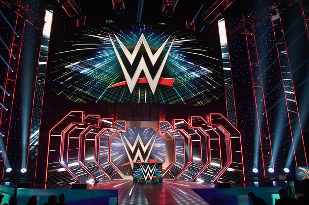 LAS VEGAS, NEVADA - OCTOBER 11:  WWE logos are shown on screens before a WWE news conference at T-Mobile Arena on October 11, 2019 in Las Vegas, Nevada. It was announced that WWE wrestler Braun Strowman will face heavyweight boxer Tyson Fury and WWE champion Brock Lesnar will take on former UFC heavyweight champion Cain Velasquez at the WWE's Crown Jewel event at Fahd International Stadium in Riyadh, Saudi Arabia on October 31.  (Photo by Ethan Miller/Getty Images)