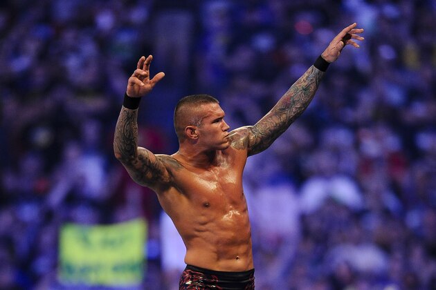 FILE- In this Sunday, April 3, 2011 file photo, WWE Superstar Randy Orton celebrates defeating CM Punk (not pictured) during WrestleMania XXVII at the Georgia Dome in Atlanta, Georgia on. World-famous WWE wrestlers such as John Cena, Shaemus and champion Randy Orton are in Saudi Arabia for three days of matches in the capital Riyadh. (Paul Abell/AP Images for WWE, File)