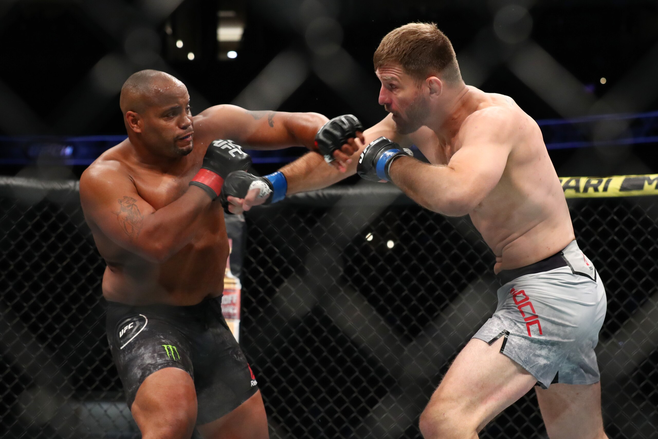 ANAHEIM, CALIFORNIA - AUGUST 17:  Daniel Cormier throws a punch at Stipe Miocic in the first round during their UFC Heavyweight Title Bout at UFC 241 at Honda Center on August 17, 2019 in Anaheim, California. (Photo by Joe Scarnici/Getty Images)