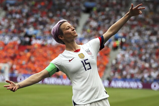 FILE - In this July 7, 2019 file photo, United States' Megan Rapinoe celebrates after scoring the opening goal from the penalty spot during the Women's World Cup final soccer match between US and The Netherlands at the Stade de Lyon in Decines, outside Lyon, France. Some athletes are criticizing the International Olympic Committee for prohibiting political protests on the medal podium. Outspoken soccer player Megan Rapinoe says she will not be silenced at the Summer Games. (AP Photo/Francisco Seco, File)