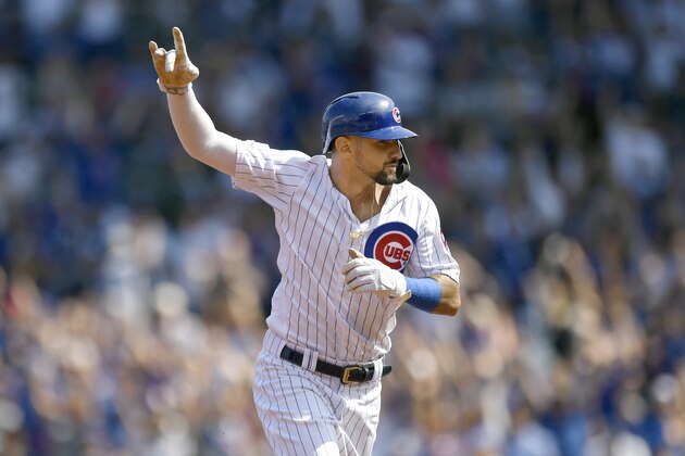 Chicago Cubs' Nicholas Castellanos celebrates while rounding the bases after Kris Bryant hit a three-run home run during the first inning of a baseball game against the Pittsburgh Pirates Sunday, Sept. 15, 2019, in Chicago. (AP Photo/Paul Beaty)