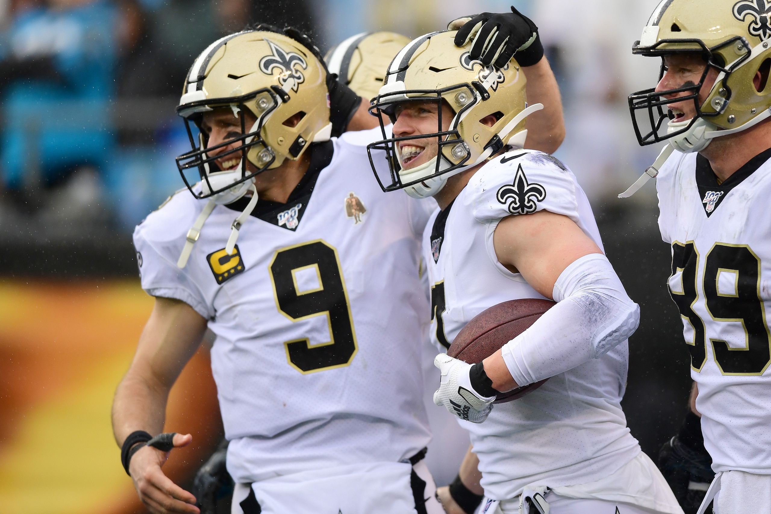 CHARLOTTE, NORTH CAROLINA - DECEMBER 29: Drew Brees #9 and Taysom Hill #7 of the New Orleans Saints celebrate a touchdown pass during the third quarter during their game against the Carolina Panthers at Bank of America Stadium on December 29, 2019 in Charlotte, North Carolina. (Photo by Jacob Kupferman/Getty Images)