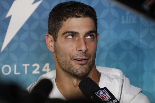 San Francisco 49ers' Jimmy Garoppolo answers questions during Opening Night for the NFL Super Bowl 54 football game Monday, Jan. 27, 2020, at Marlins Park in Miami. (AP Photo/Chris Carlson)