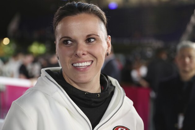 San Francisco 49ers offensive assistant coach Katie Sowers speaks to the media during Opening Night for the NFL Super Bowl 54 football game, Monday, Jan. 27, 2020, in Miami. (AP Photo/Steve Luciano)