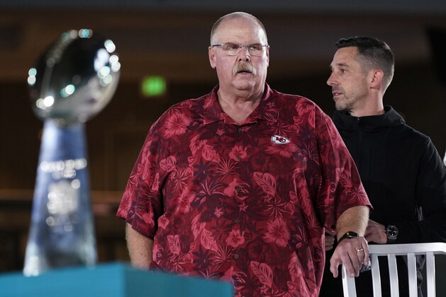 Kansas City Chiefs' coach Andy Reid, left, stands next to San Francisco 49ers coach Kyle Shanahan during Opening Night for the NFL Super Bowl 54 football game Monday, Jan. 27, 2020, at Marlins Park in Miami. (AP Photo/David J. Phillip)