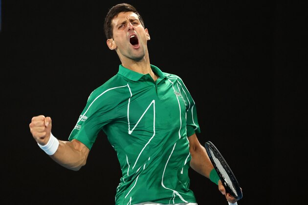 Serbia's Novak Djokovic reacts after winning his first set against Canada's Milos Raonic during their men's singles quarter-final match on day nine of the Australian Open tennis tournament in Melbourne on January 28, 2020. (Photo by DAVID GRAY / AFP) / IMAGE RESTRICTED TO EDITORIAL USE - STRICTLY NO COMMERCIAL USE (Photo by DAVID GRAY/AFP via Getty Images)