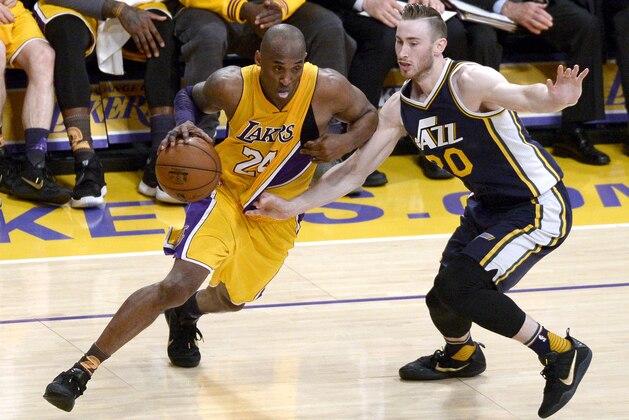 Kobe Bryant #24 of the Los Angeles Lakers drives on Gordon Hayward #20 of the Utah Jazz in the fourth quarter at Staples Center on April 13, 2016 in Los Angeles, California.  (Photo by Kevork Djansezian/Getty Images)