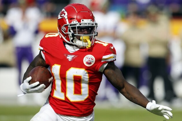 FILE - In this Sunday, Nov. 3, 2019, file photo, Kansas City Chiefs wide receiver Tyreek Hill (10) carries the ball during the first half of an NFL football game against the Minnesota Vikings in Kansas City, Mo. It would be an understatement to the greatest degree to say that Chiefs wide receiver has had an eventful year, one marked by the highest of highs and the lowest of lows. Now, he’s hoping to return from a hamstring injury in time to help Kansas City win a fourth consecutive AFC West championship.(AP Photo/Colin E. Braley, File)
