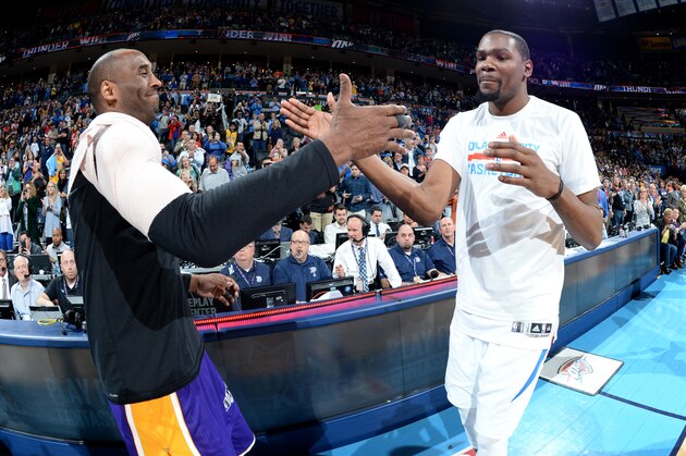 OKLAHOMA CITY, OK - APRIL 11:  Kobe Bryant #24 of the Los Angeles Lakers greets Kevin Durant #35 of the Oklahoma City Thunder after the game at Chesapeake Energy Arena on April 11, 2016 in Oklahoma City, Oklahoma. NOTE TO USER: User expressly acknowledges and agrees that, by downloading and/or using this Photograph, user is consenting to the terms and conditions of the Getty Images License Agreement. Mandatory Copyright Notice: Copyright 2016 NBAE (Photo by Andrew D. Bernstein/NBAE via Getty Images)